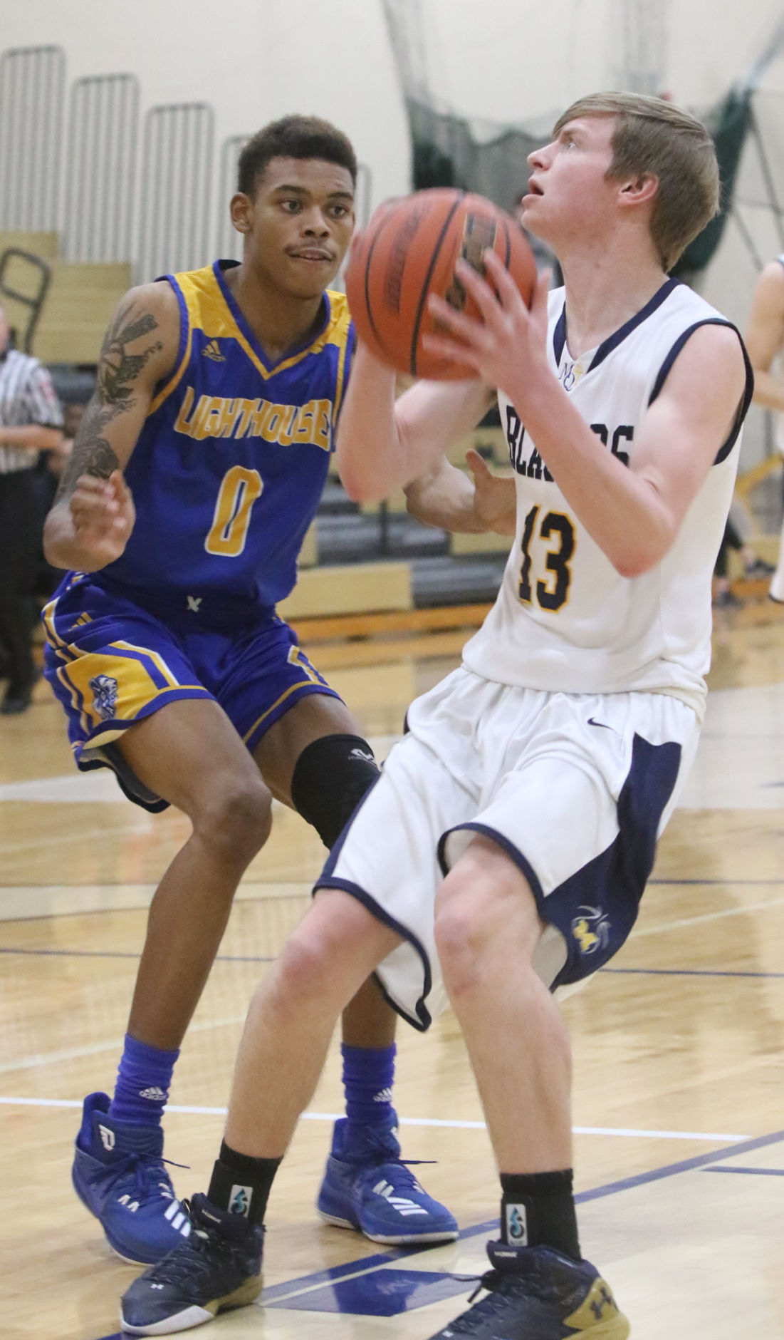 Lighthouse at Marquette Catholic boys basketball